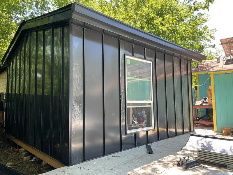 Black standing seam metal wall panels for Roof Inspection in Apopka