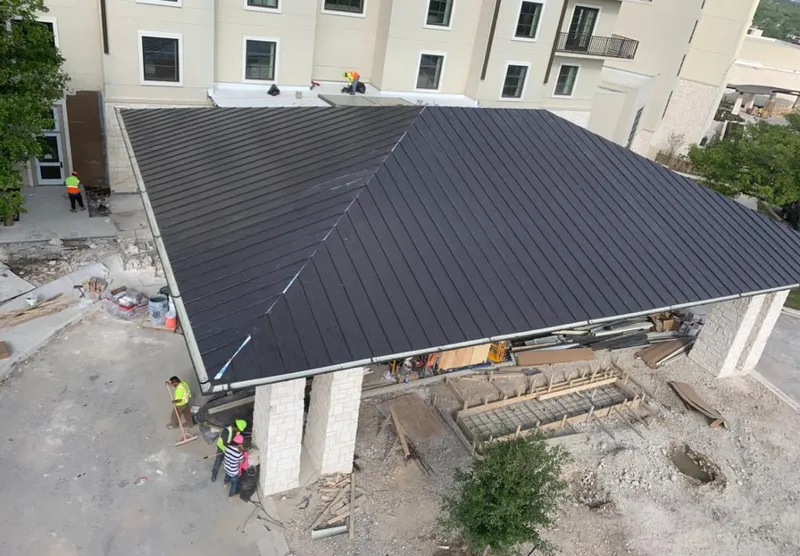 Metal roofing installation team working on a commercial building in Apopka